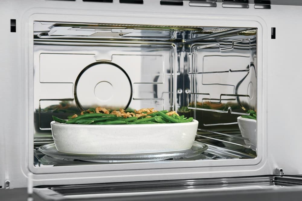 Frigidaire FGMO3067UD 30 Inch Built In Microwave with Drop Down Door Interior LED Lighting Effortless Reheat Sensor Cooking Options Smudge Proof Black Stainless Steel and Fits More Microwave