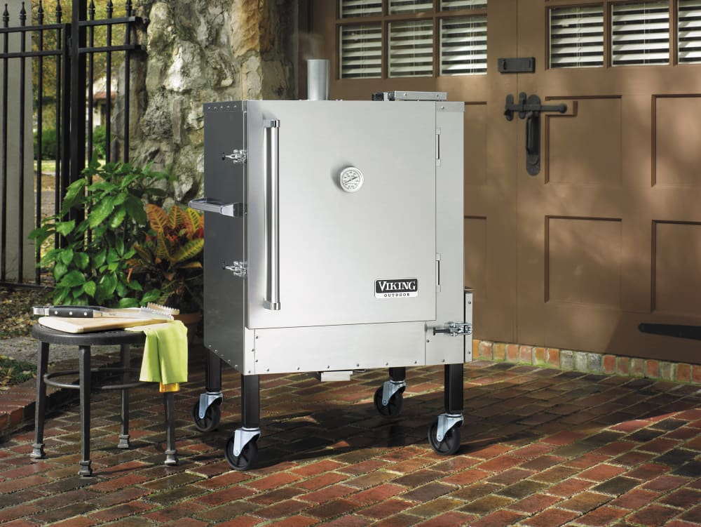 Gravity feed charcoal smoker outlet