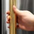 ZLINE Autograph Edition RBIVHZKG30 - ZLINE Autograph Edition 30 in. Built-In Refrigerator Helix Handles (Set of 2) in Polished Gold (RBIVHZ-K-G-30) on appliance showing diamond knurled details. Built In Refrigerator Handles