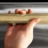 ZLINE DWHZKCB24 - ZLINE Autograph Edition 24 in. Dishwasher Helix Handle (Set of 1) in Champagne Bronze (DWHZ-K-CB-24) on appliance showing diamond knurled details. 24 Inch Handle
