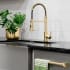 ZLINE RBCN2KFCB - ZLINE Palisades Pull Down Spring Spray Wand Kitchen Faucet in Champagne Bronze (RBCN2-KF-CB) in a luxury kitchen, water on.