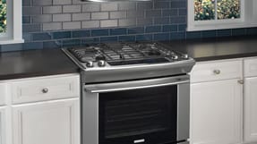 Cooking Appliances, Gas Ranges, Wall ovens, Cooktops, Microwaves ... - Slide-in ranges come without side panels and have a slightly protruding  cooktop. This allows the surface of the cooktop to overlay onto the counter  for a ...
