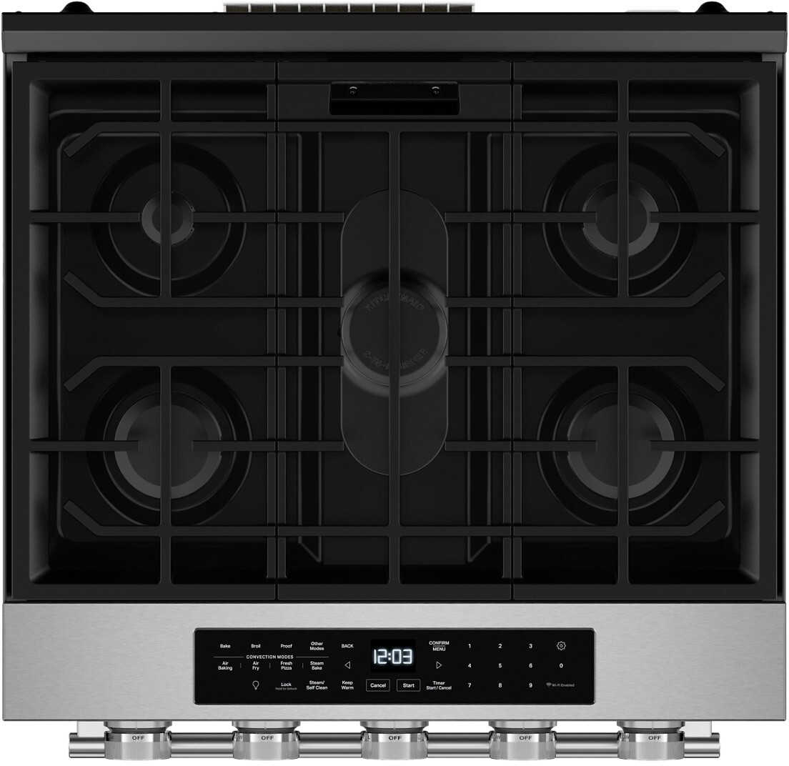 Top-down view of five-burner cooktop with center oval burner and touch control panel