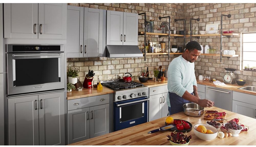 Ink blue KitchenAid gas range installed in a kitchen