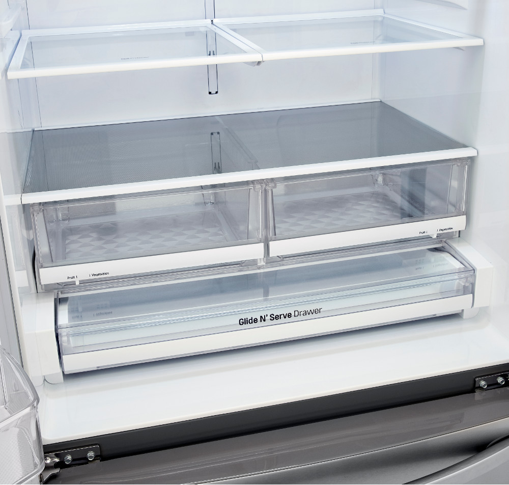 Close-up of two clear crisper drawers and a wide Glide N' Serve drawer