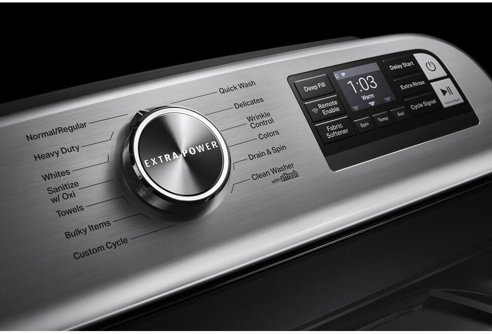 Close-up of the Maytag MVW7230HC washer control panel showing the Extra Power dial, cycle list, and digital display with options like Deep Fill, Delay Start, and Remote Enable.